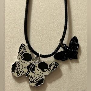 NWOT necklace w Moth skull 1” & black Moth .5” silvertone, 18” adj. cord chain.